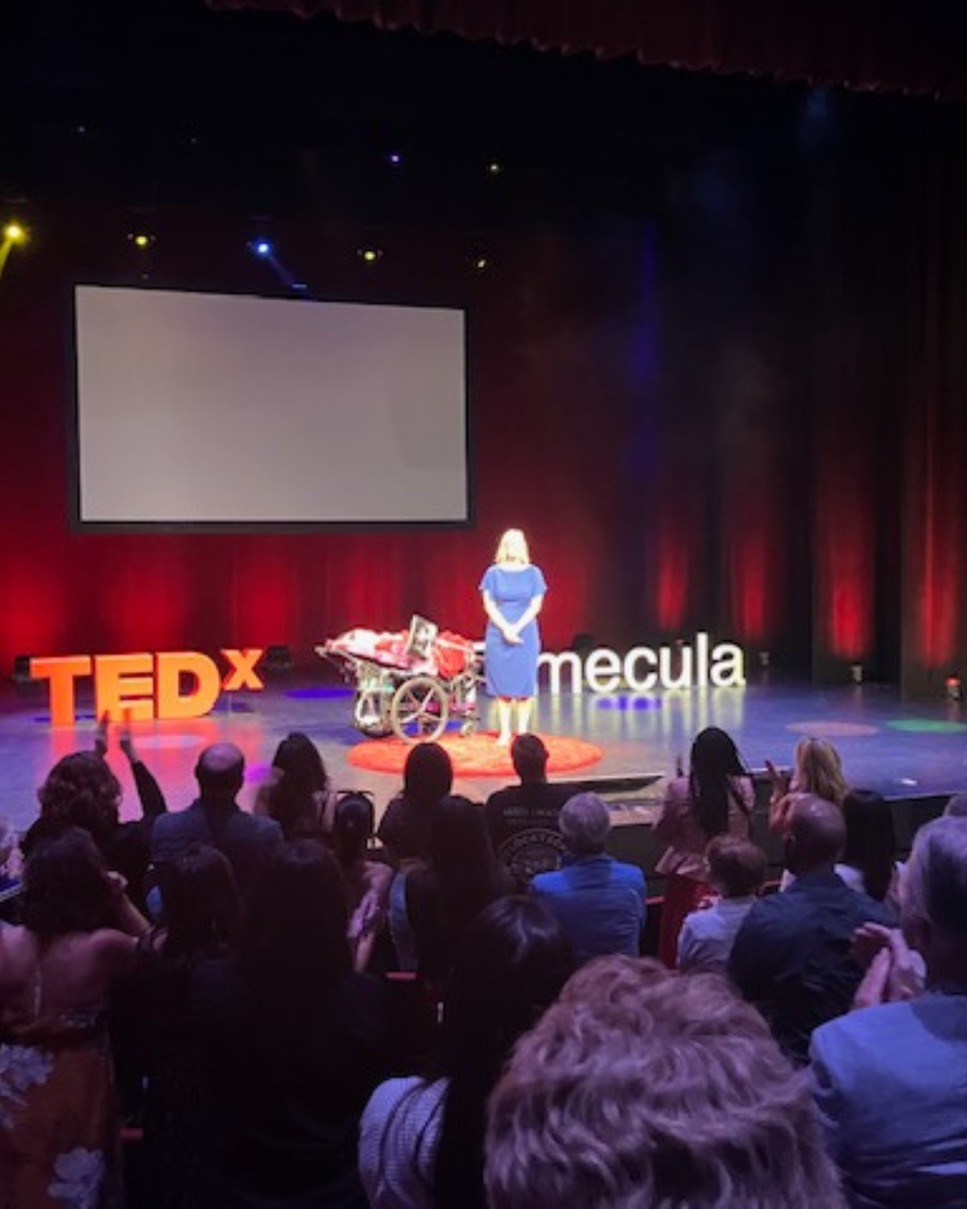 Kennedy and Jennifer on stage during their Tedx talk.